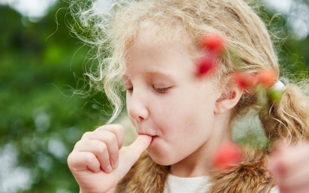 Child sucking their thumb