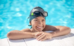 Child smiling in pool