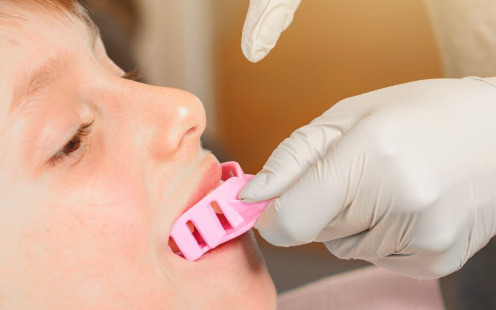 Child wearing a mouthguard