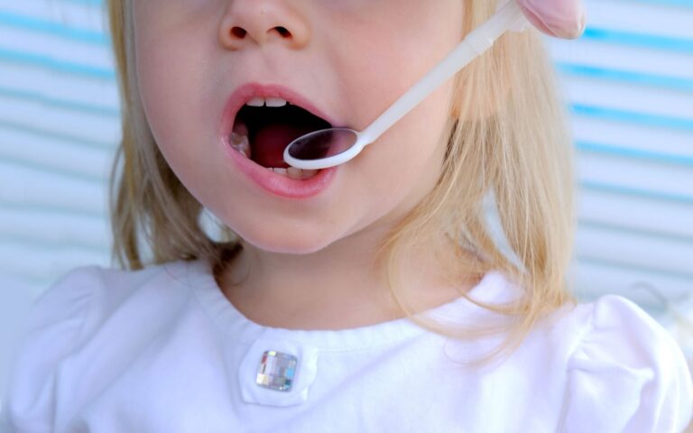 Young girl getting molars checkup