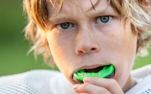 Kid with dental mouthguard