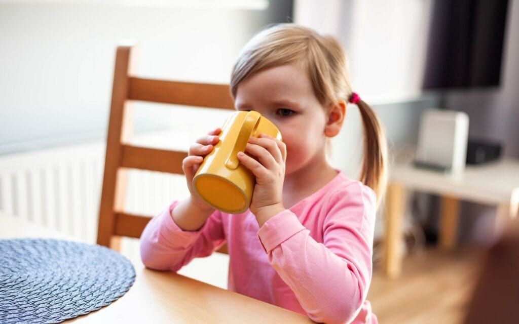 Child drinking a tooth healthy drink