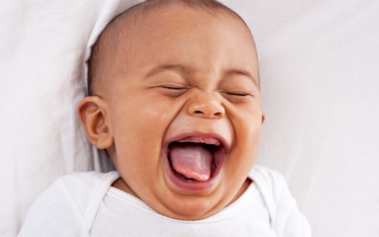 Child with smiling open mouth