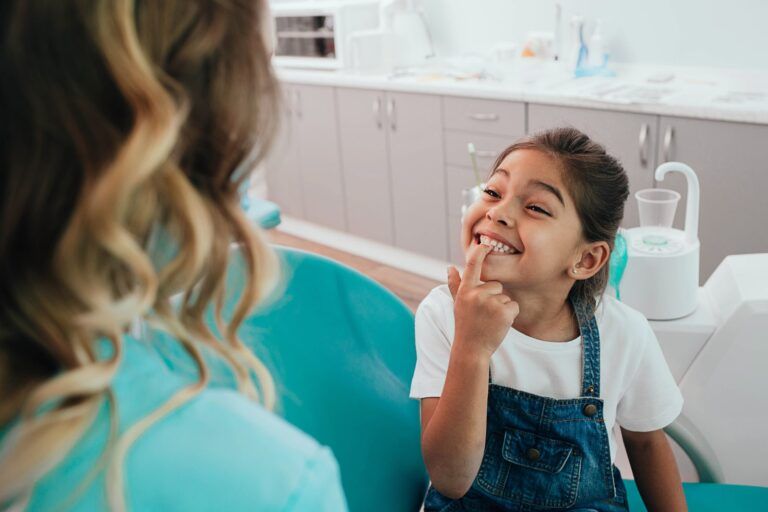 Child Smiling at Dentist