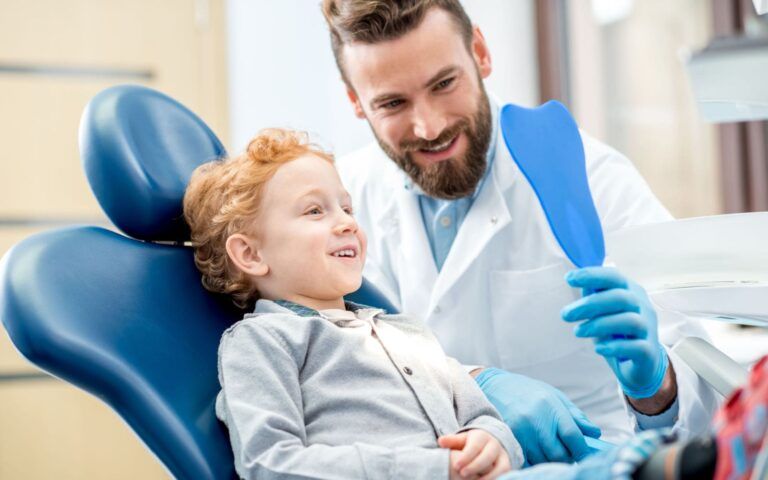 Pediatric Dentist with Child Patient